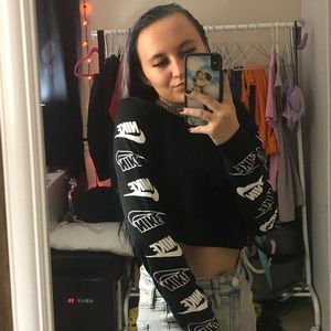 black semi cropped nike swoosh arm decal